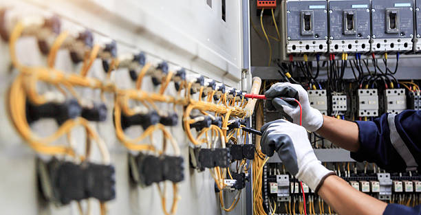 Professional Electrician technician working in Fort Myers Beach, FL
